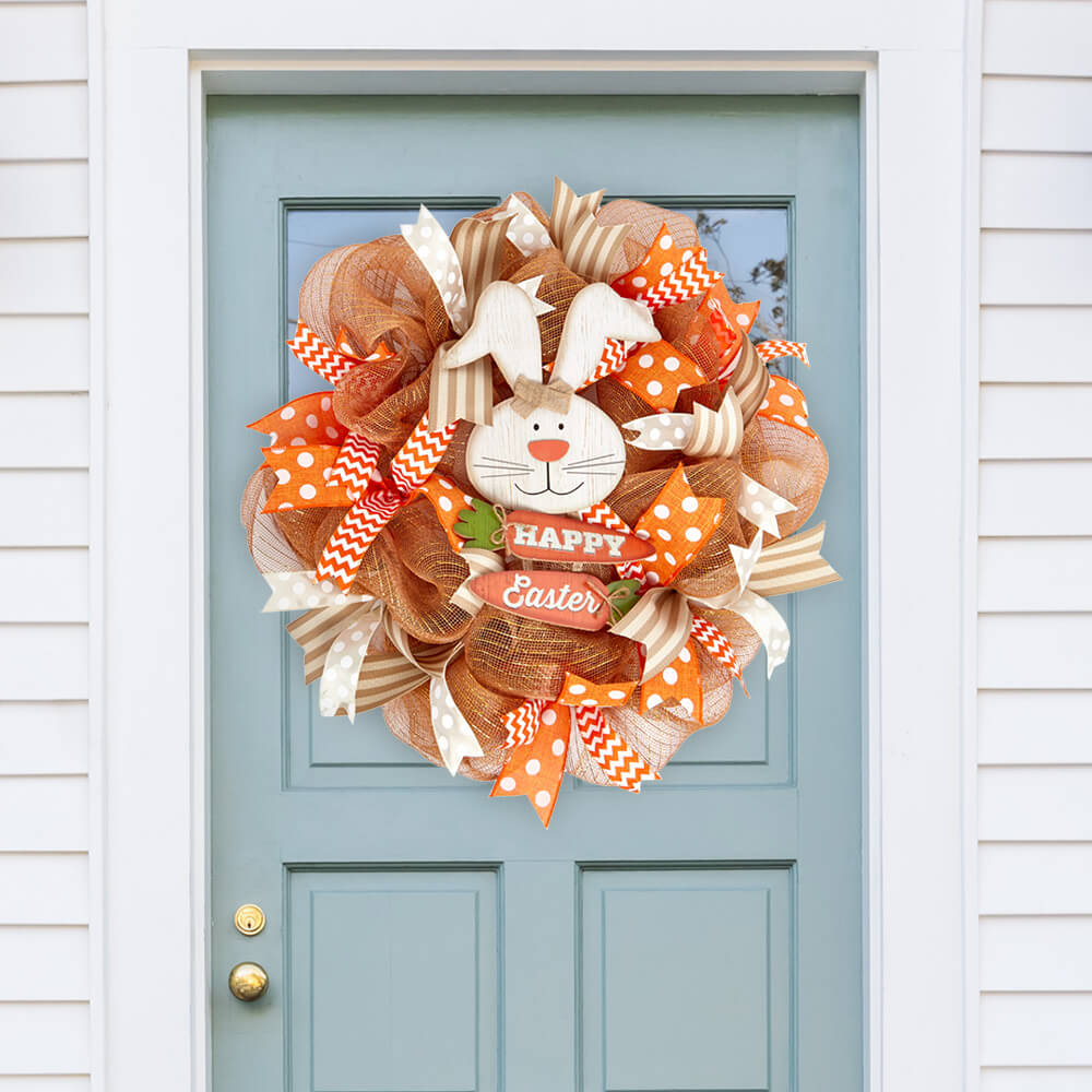Easter wreath made with Paper Mart ribbons and deco mesh displayed on a door